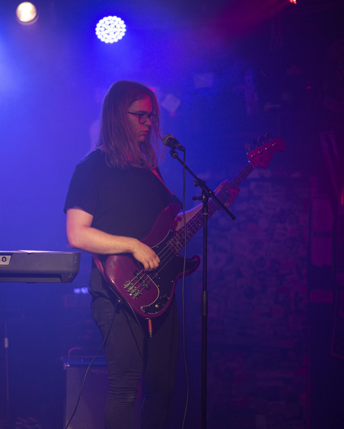 Angela Branchek performing bass guitar live